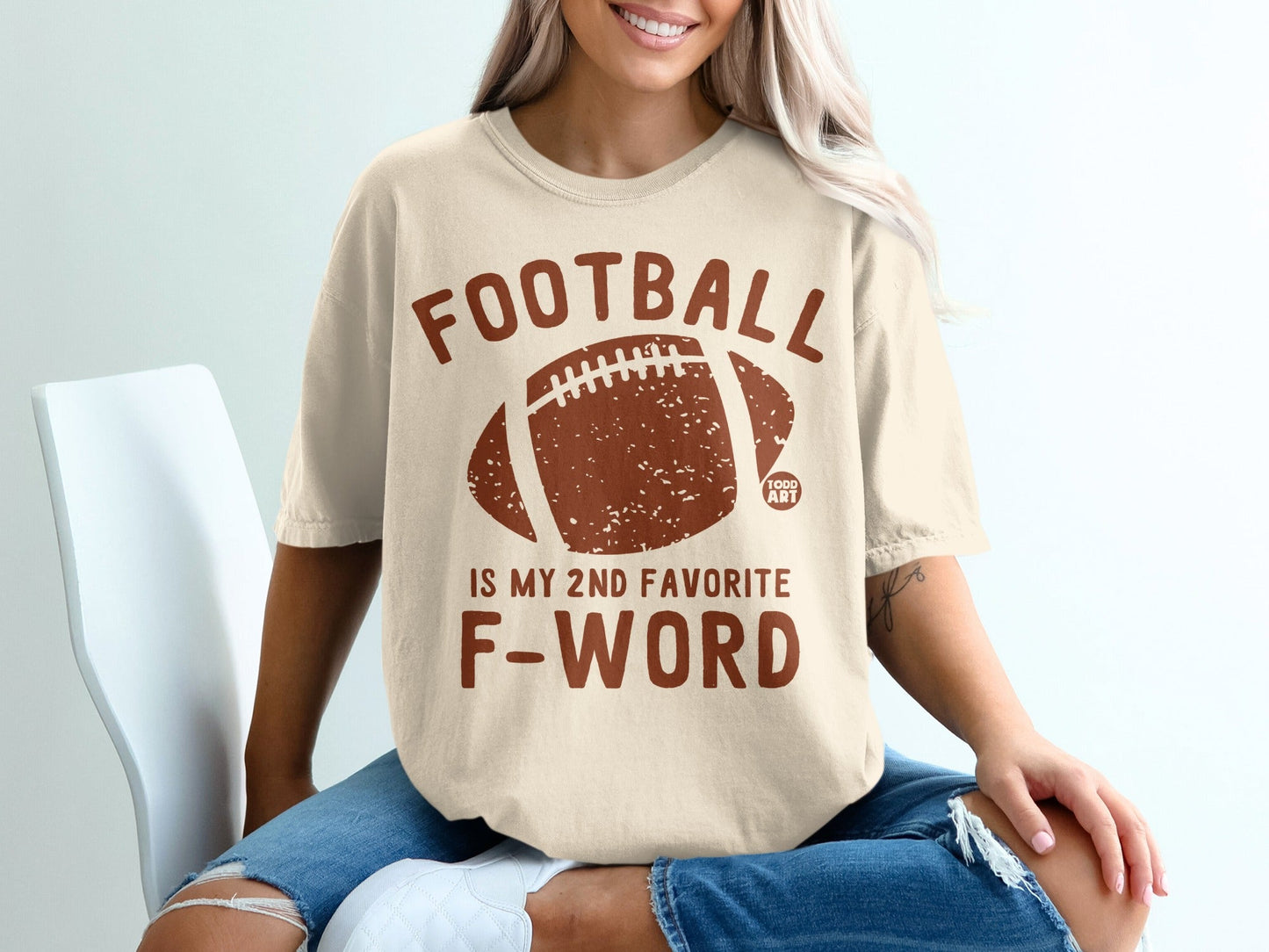 Cream t-shirt with "FOOTBALL IS MY 2ND FAVORITE F-WORD" and football graphic.