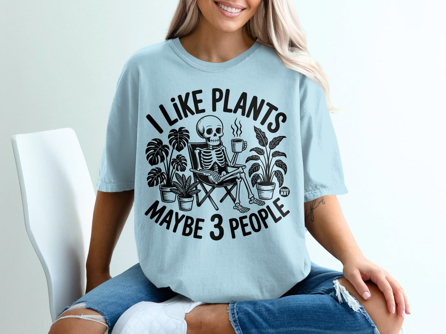 Skeleton sitting in a chair with plants, drinking coffee, text "I like plants maybe 3 people".