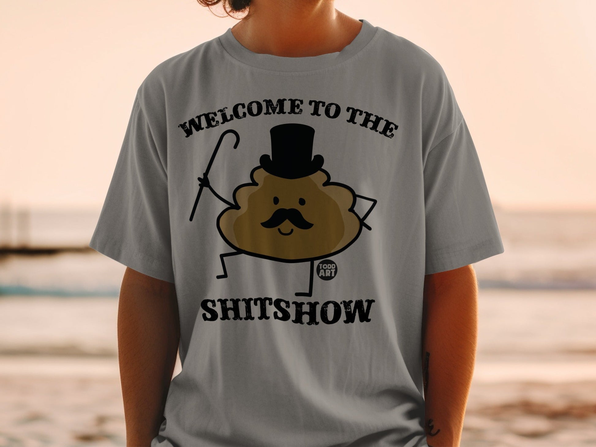 Brown cartoon poop character wearing top hat and holding cane, text WELCOME TO THE SHITSHOW.