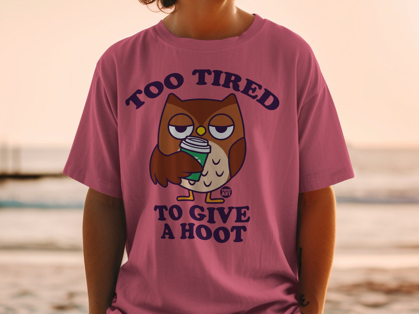 T-shirt with cartoon owl holding coffee cup and text "Too tired to give a hoot."