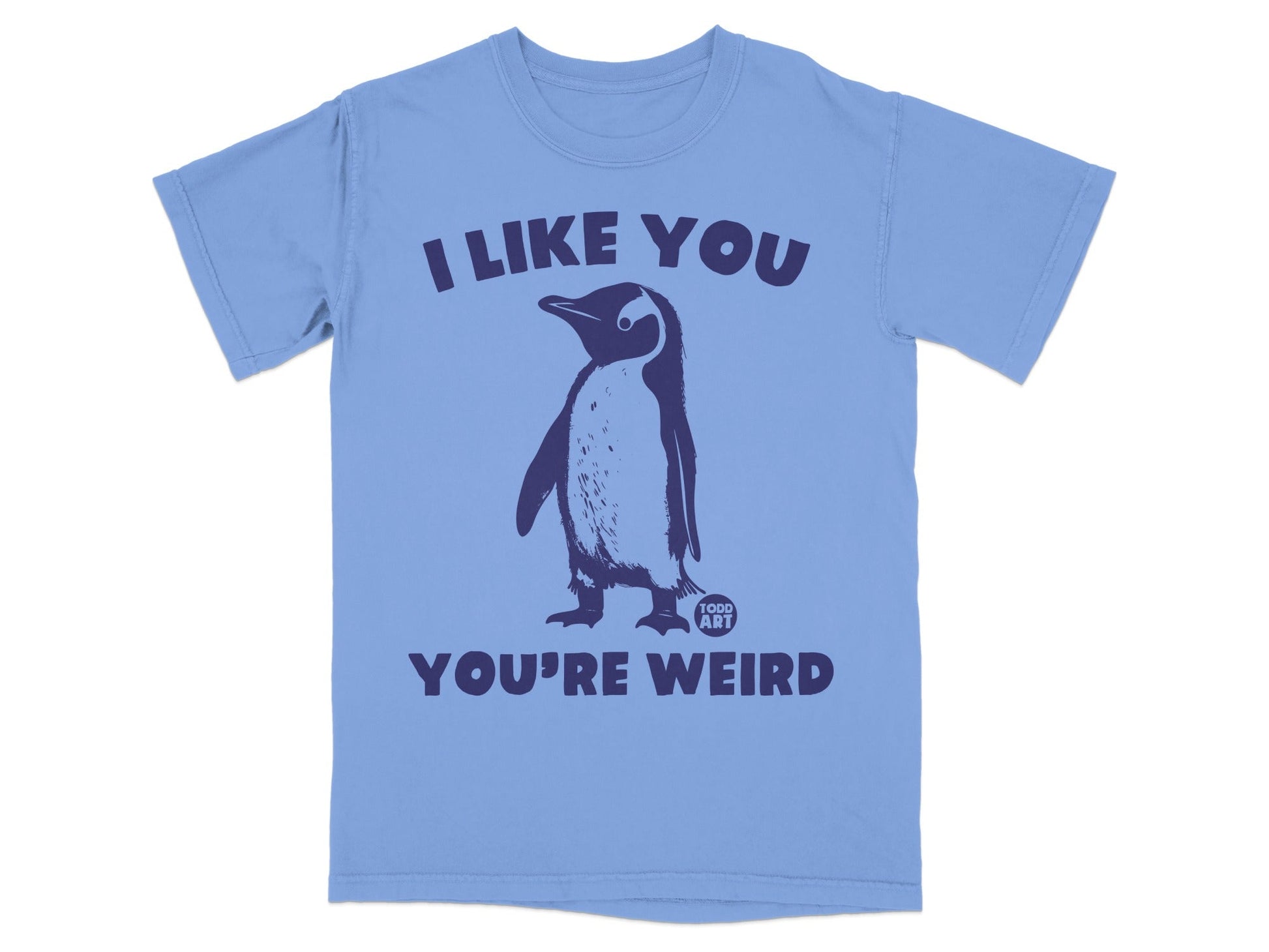 Light blue t-shirt with a navy penguin and text "I LIKE YOU YOU'RE WEIRD".