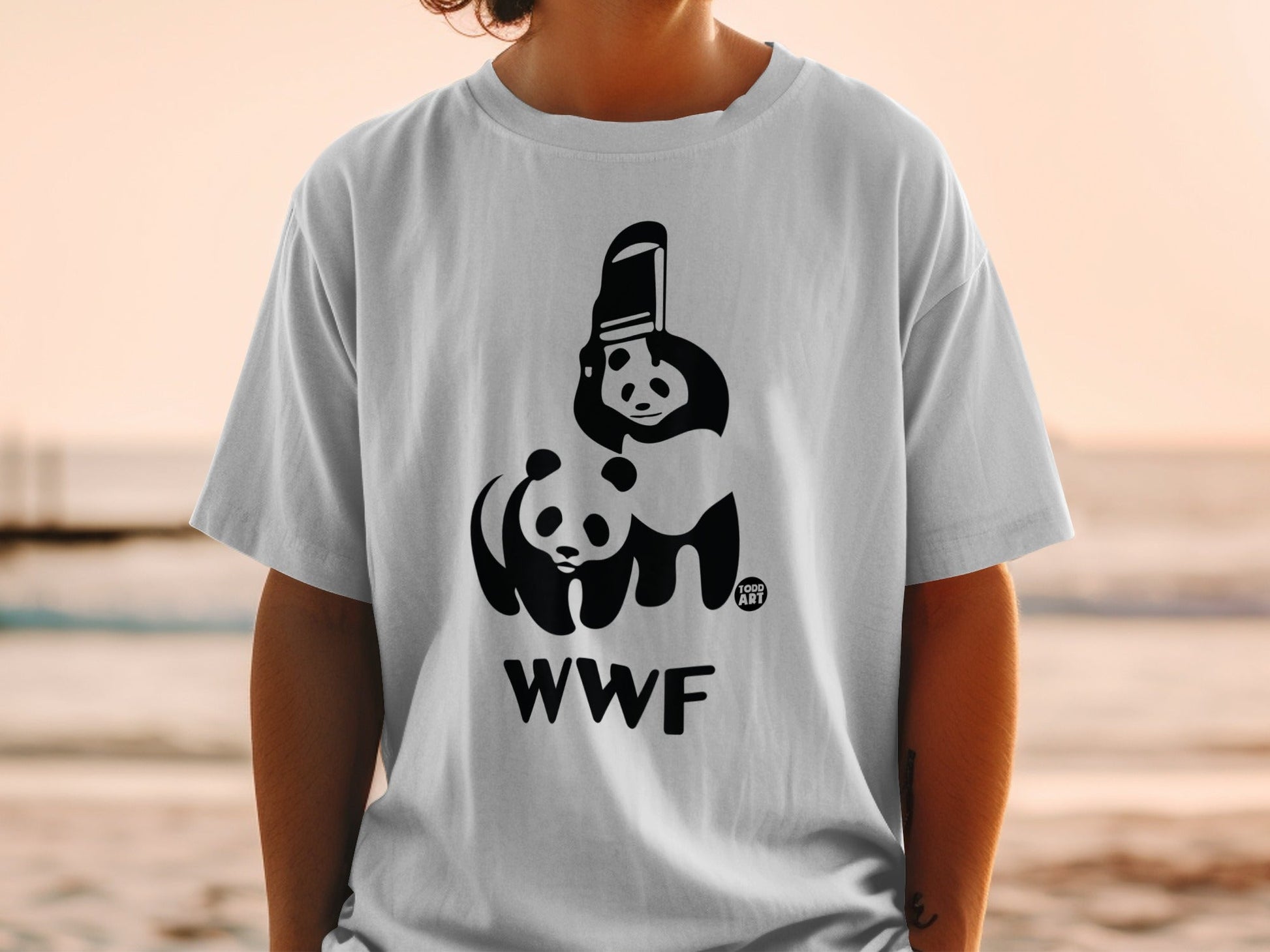 White t-shirt with black panda graphic and WWF logo.