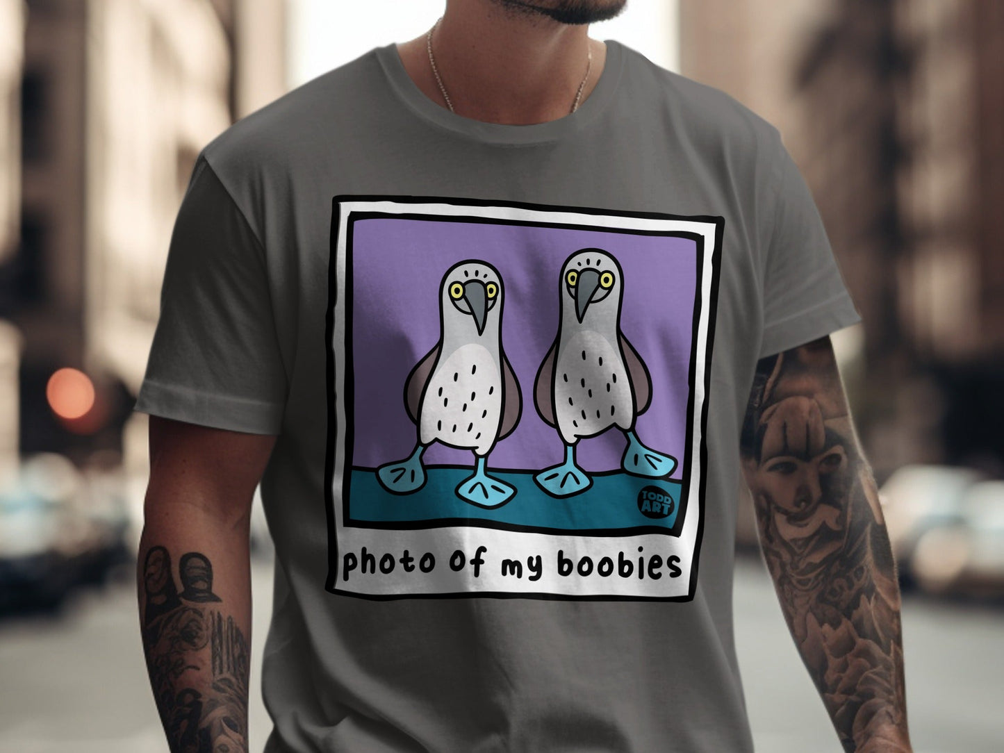 Two cartoon booby birds on a purple background, with text "photo of my boobies".