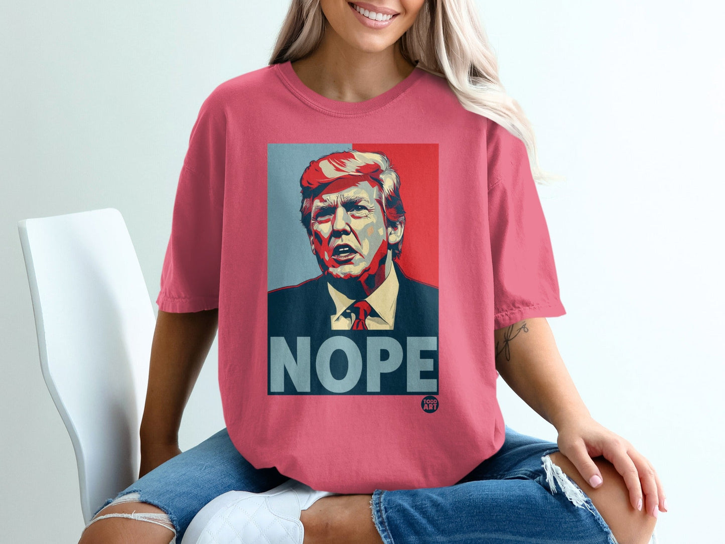 Pink t-shirt featuring Donald Trump graphic with "NOPE" text.