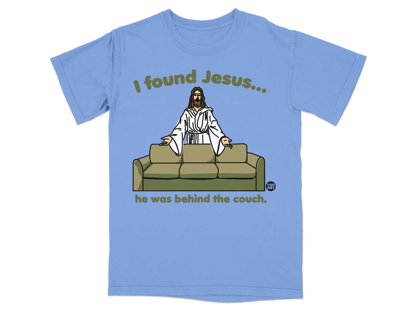 Light blue t-shirt with "I found Jesus... he was behind the couch" text.