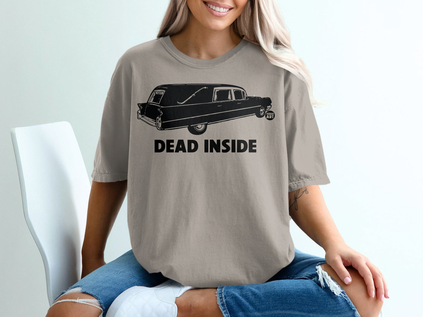 T-shirt with a hearse graphic and "DEAD INSIDE" text.