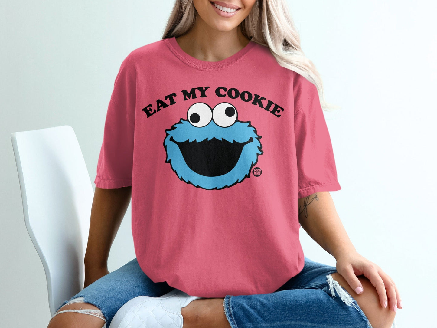 Pink t-shirt with Cookie Monster saying "Eat My Cookie".