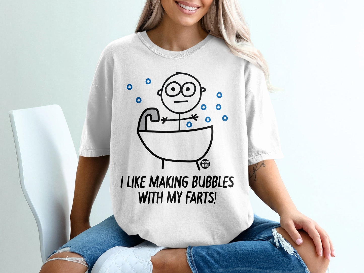 T-shirt with cartoon figure in bathtub, "I like making bubbles with my farts!"