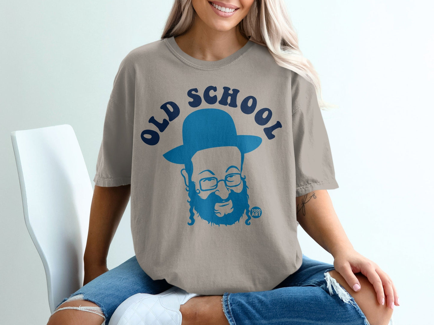 Tan t-shirt with blue "OLD SCHOOL" text and cartoon portrait of a man.