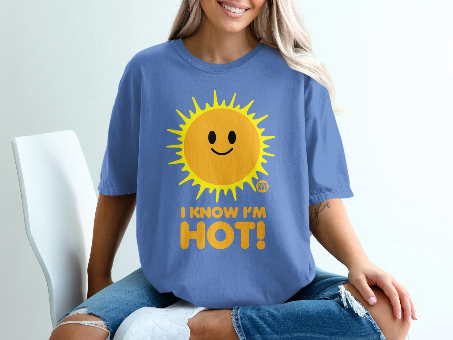 Blue t-shirt with a smiling sun graphic and "I KNOW I'M HOT!" text.