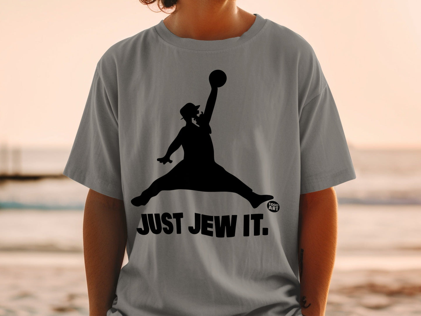 Silhouette of a person in mid-air, jumping, wearing a hat, with "JUST JEW IT." text.