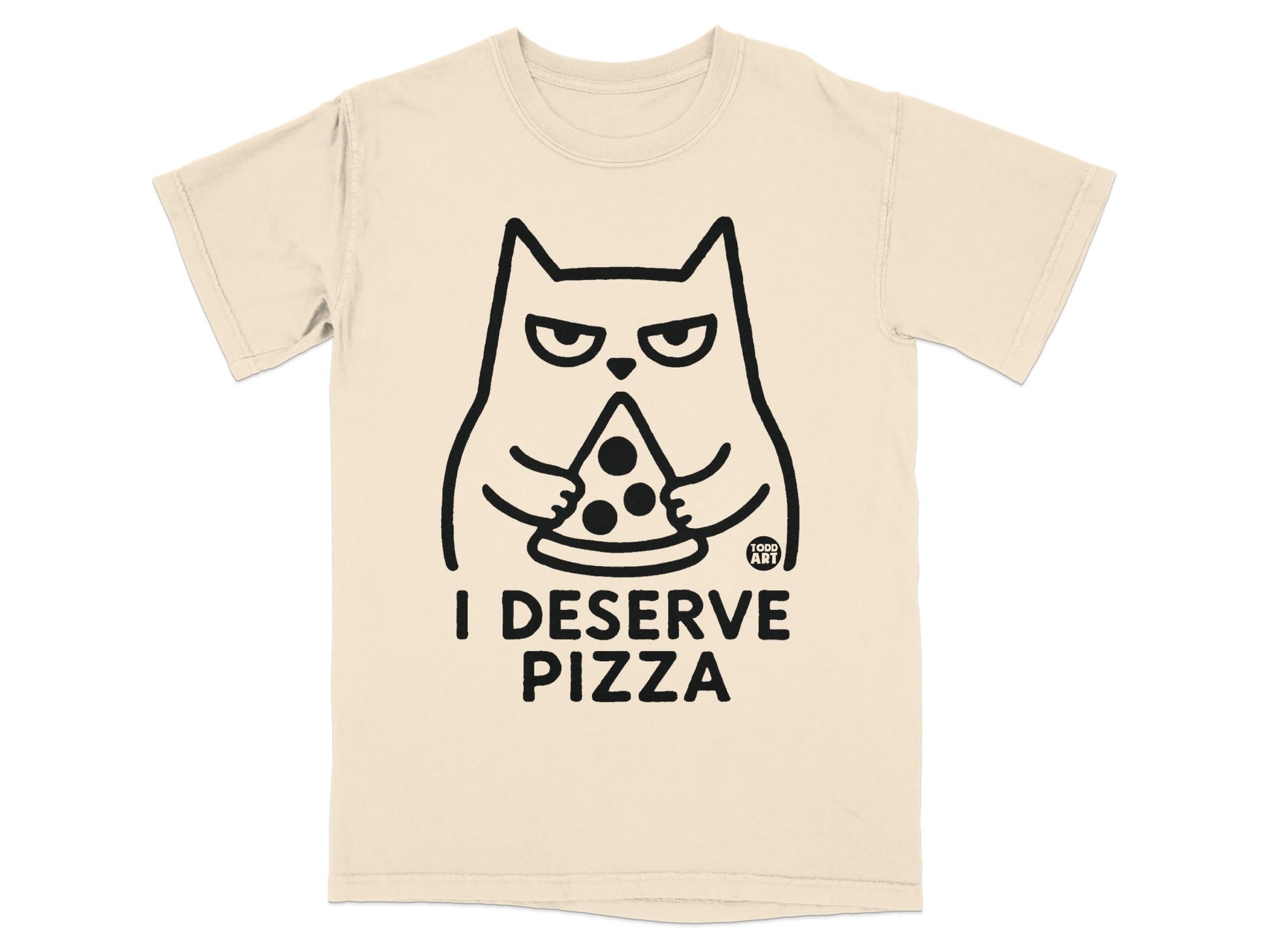 Cream t-shirt with a cartoon cat holding a pizza slice and text "I DESERVE PIZZA".