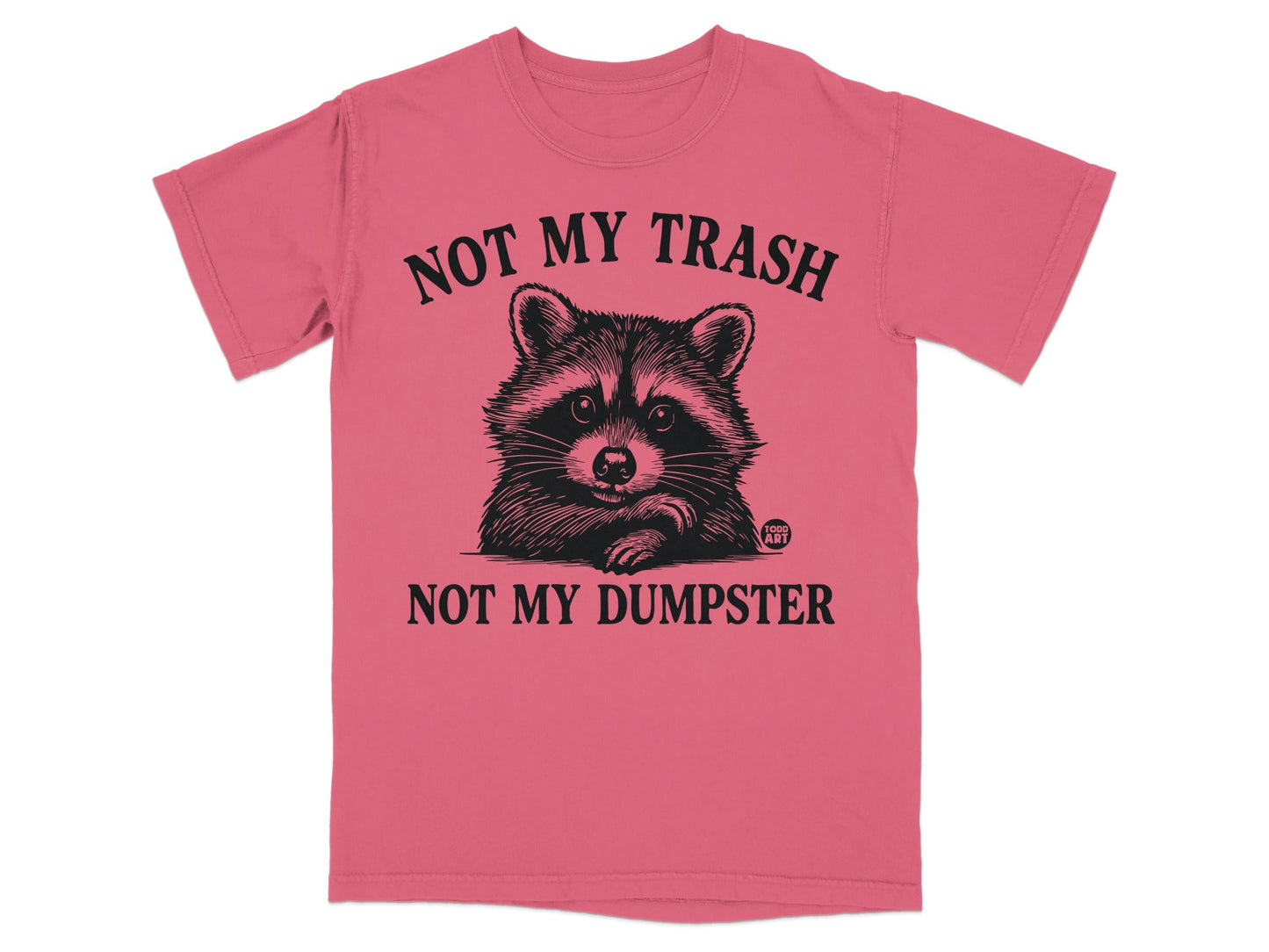Pink t-shirt with a raccoon and text "NOT MY TRASH NOT MY DUMPSTER".