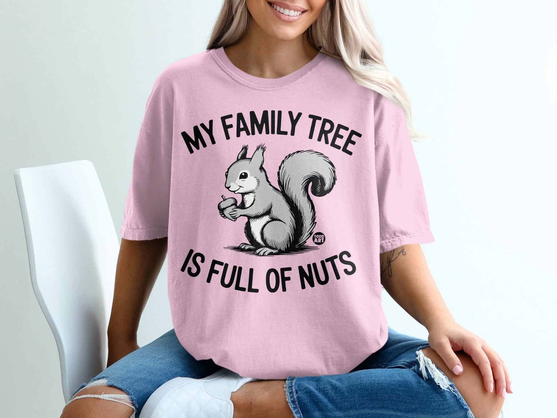 Pink t-shirt with a squirrel and the text "MY FAMILY TREE IS FULL OF NUTS".