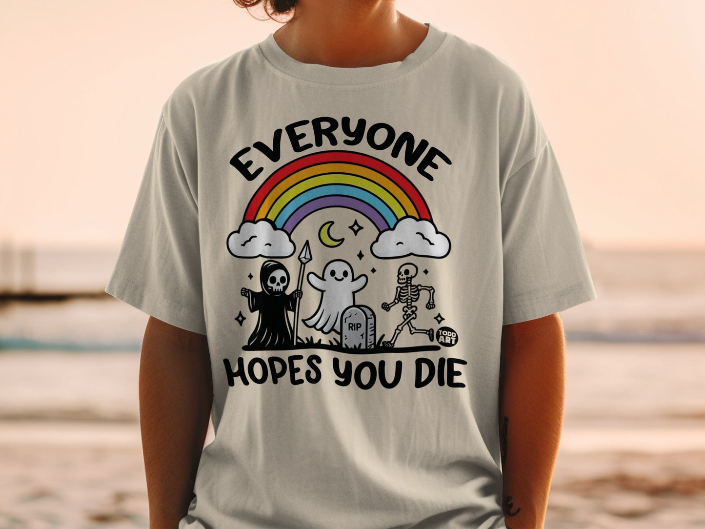 Shirt with Grim Reaper, ghost, skeleton, and rainbow, reading "Everyone Hopes You Die".