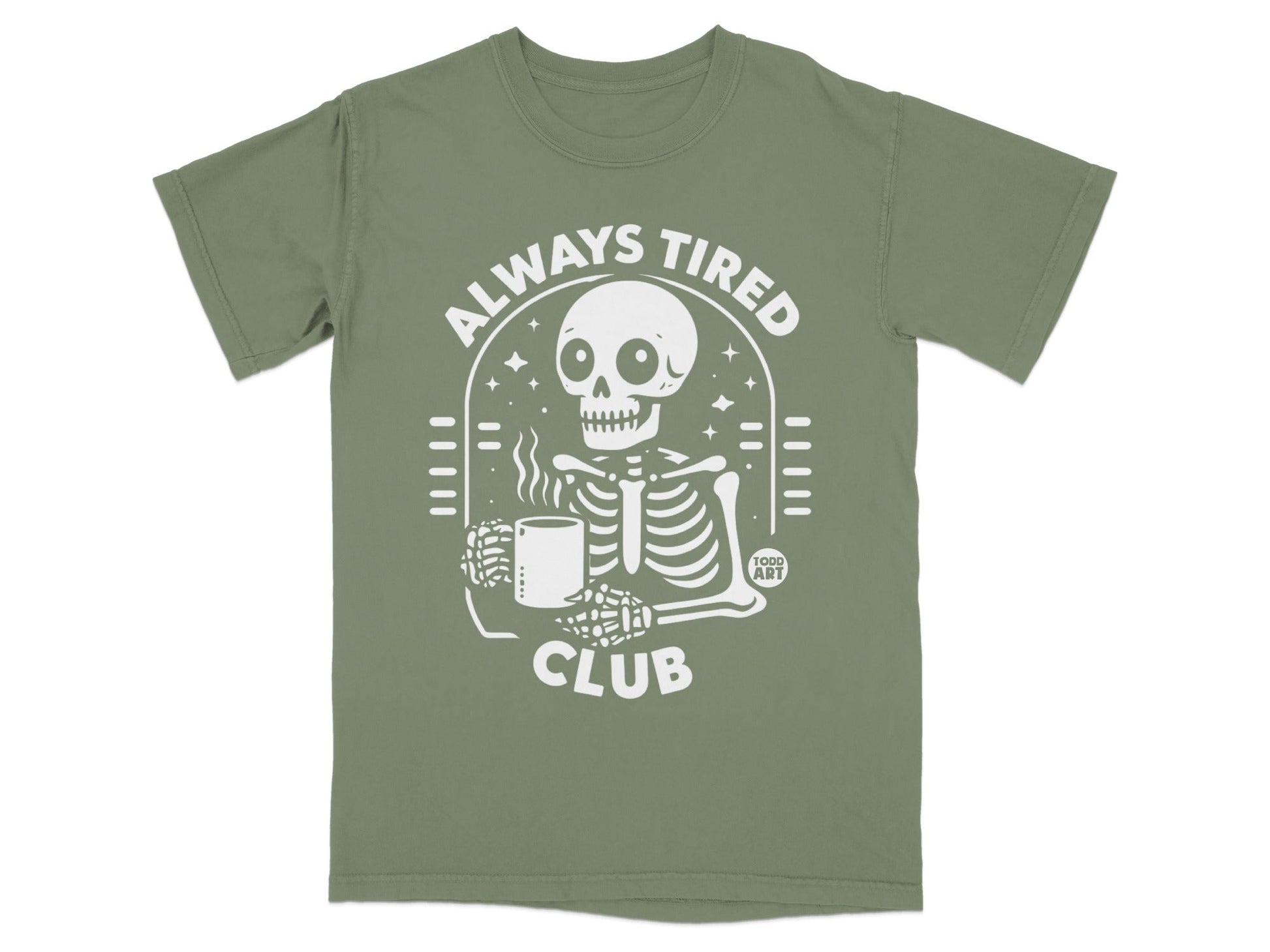 Olive green t-shirt with a white skeleton graphic and "ALWAYS TIRED CLUB" text.