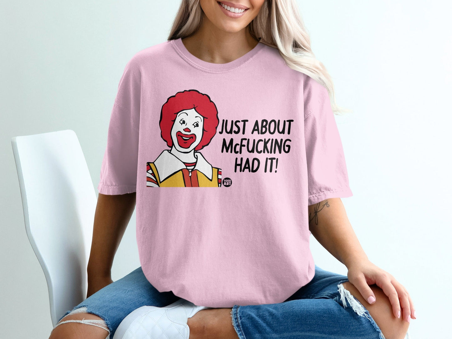 Pink t-shirt with cartoon Ronald McDonald and text "JUST ABOUT MCFUCKING HAD IT!".