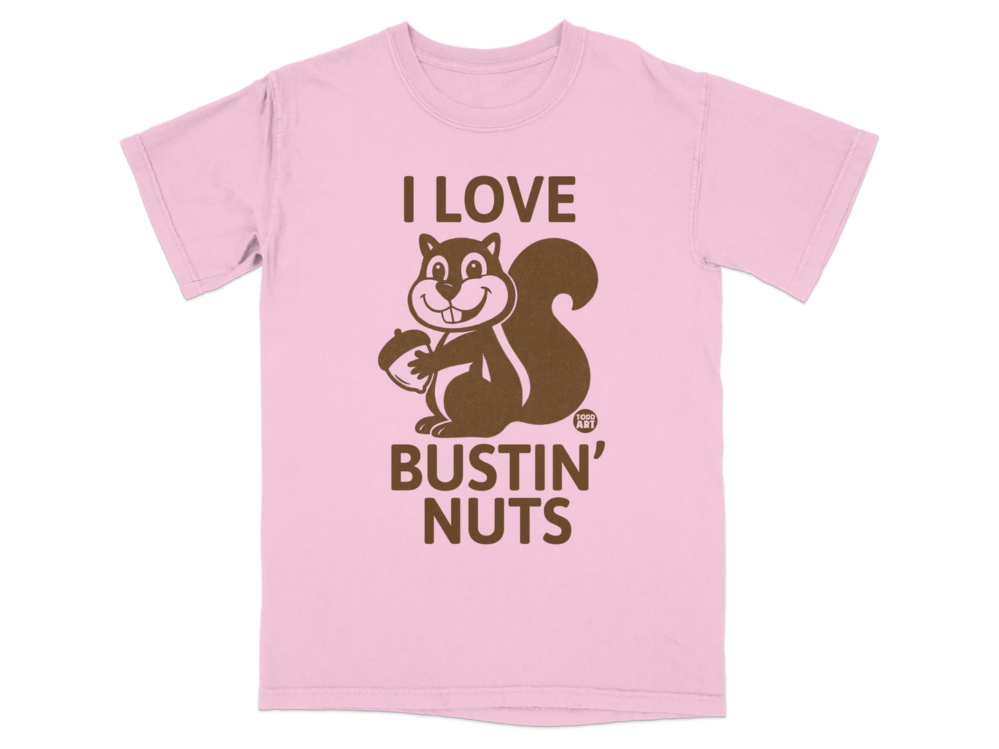Pink t-shirt with a cartoon squirrel holding an acorn and the text "I LOVE BUSTIN' NUTS".