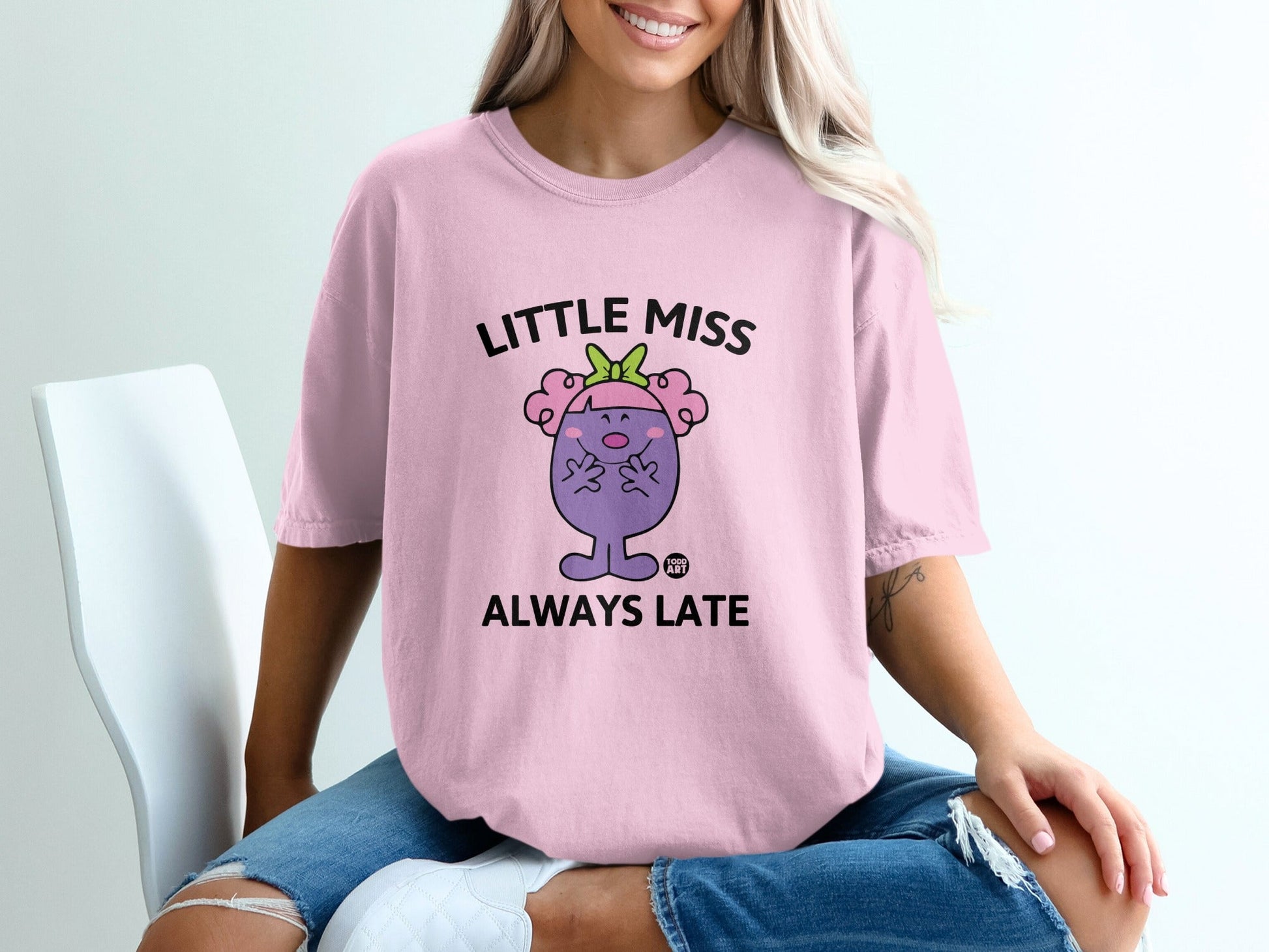 Pink t-shirt with "Little Miss Always Late" text and cartoon character.
