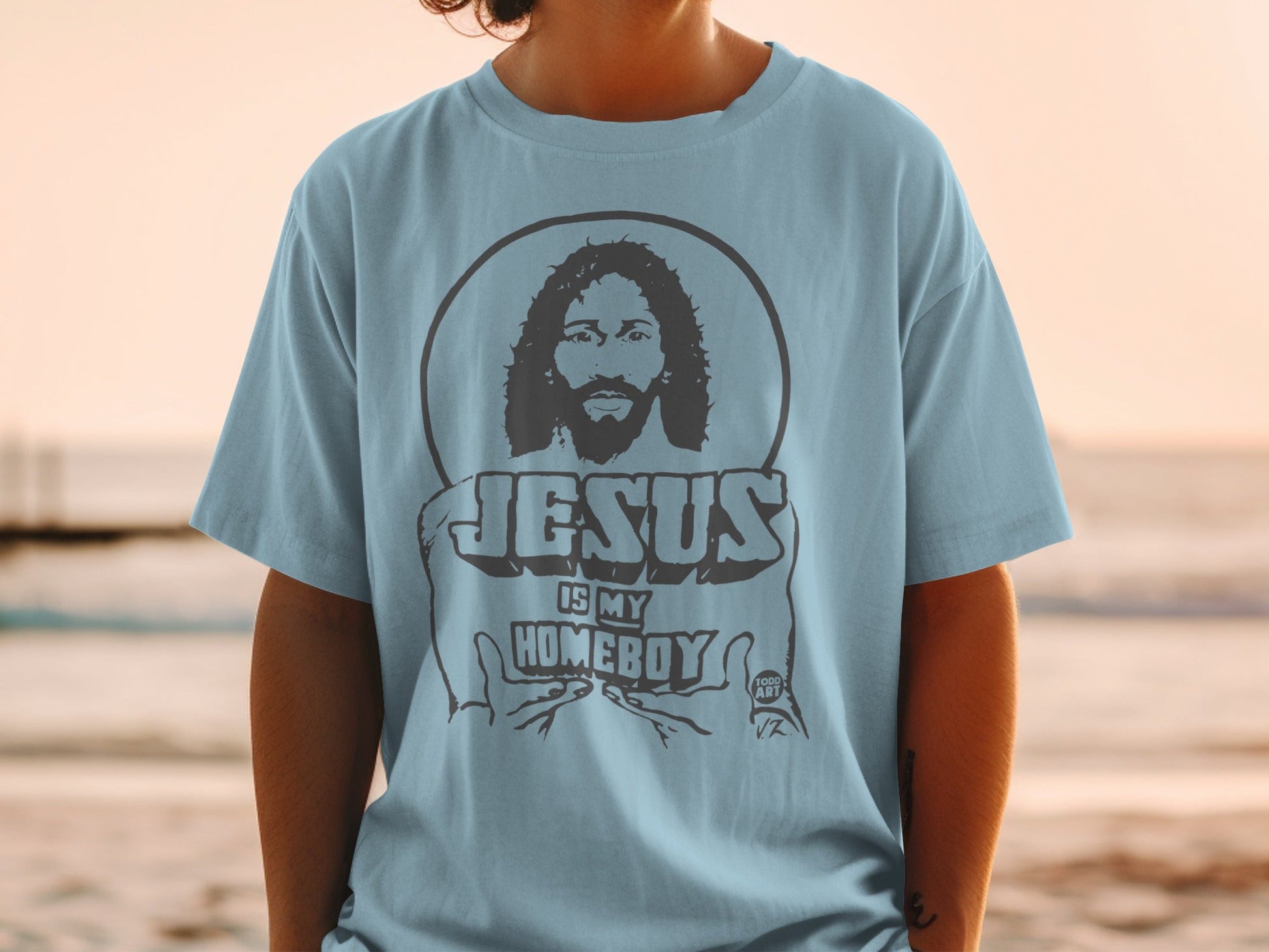 Light blue t-shirt with "Jesus is My Homeboy" graphic and Jesus portrait.