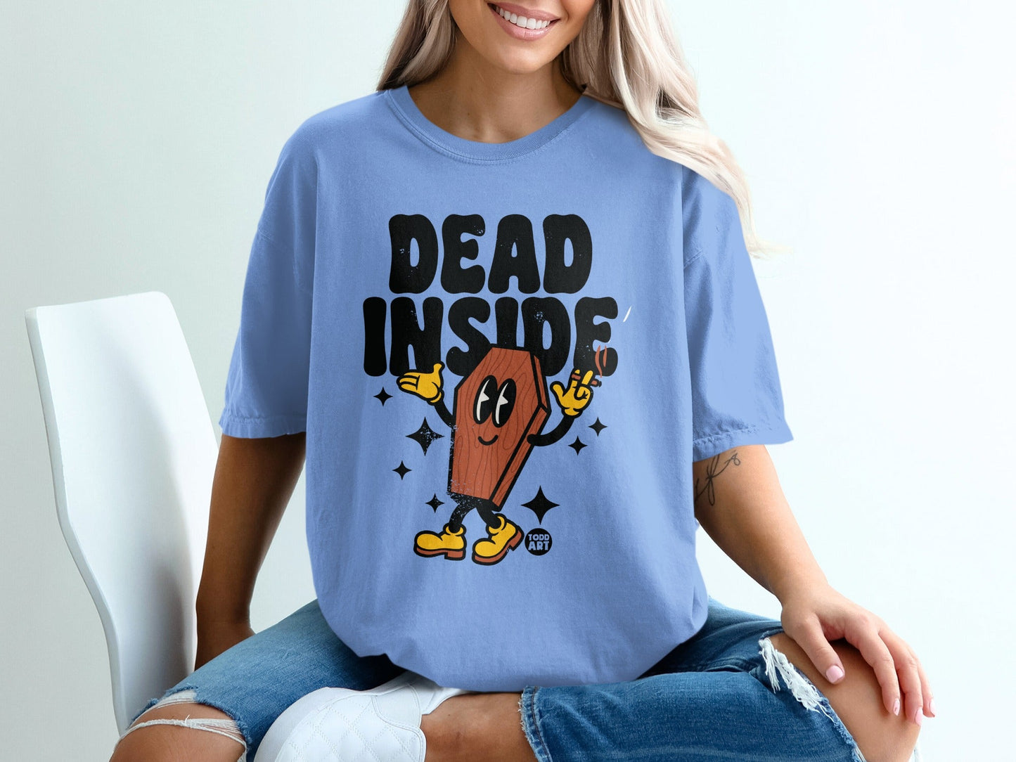 T-shirt with cartoon coffin character saying "DEAD INSIDE".