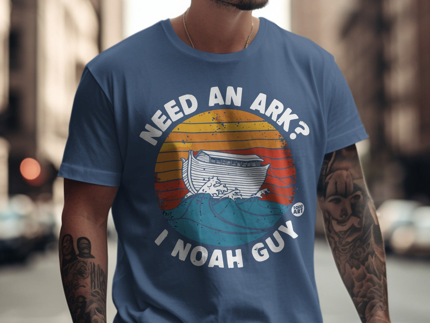 T-shirt with "Need an Ark? I Noah Guy" text and Noah's Ark graphic.