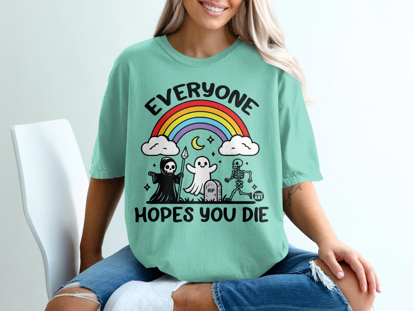 Mint t-shirt with ghost, skeleton, and reaper graphic and "Everyone hopes you die" text.