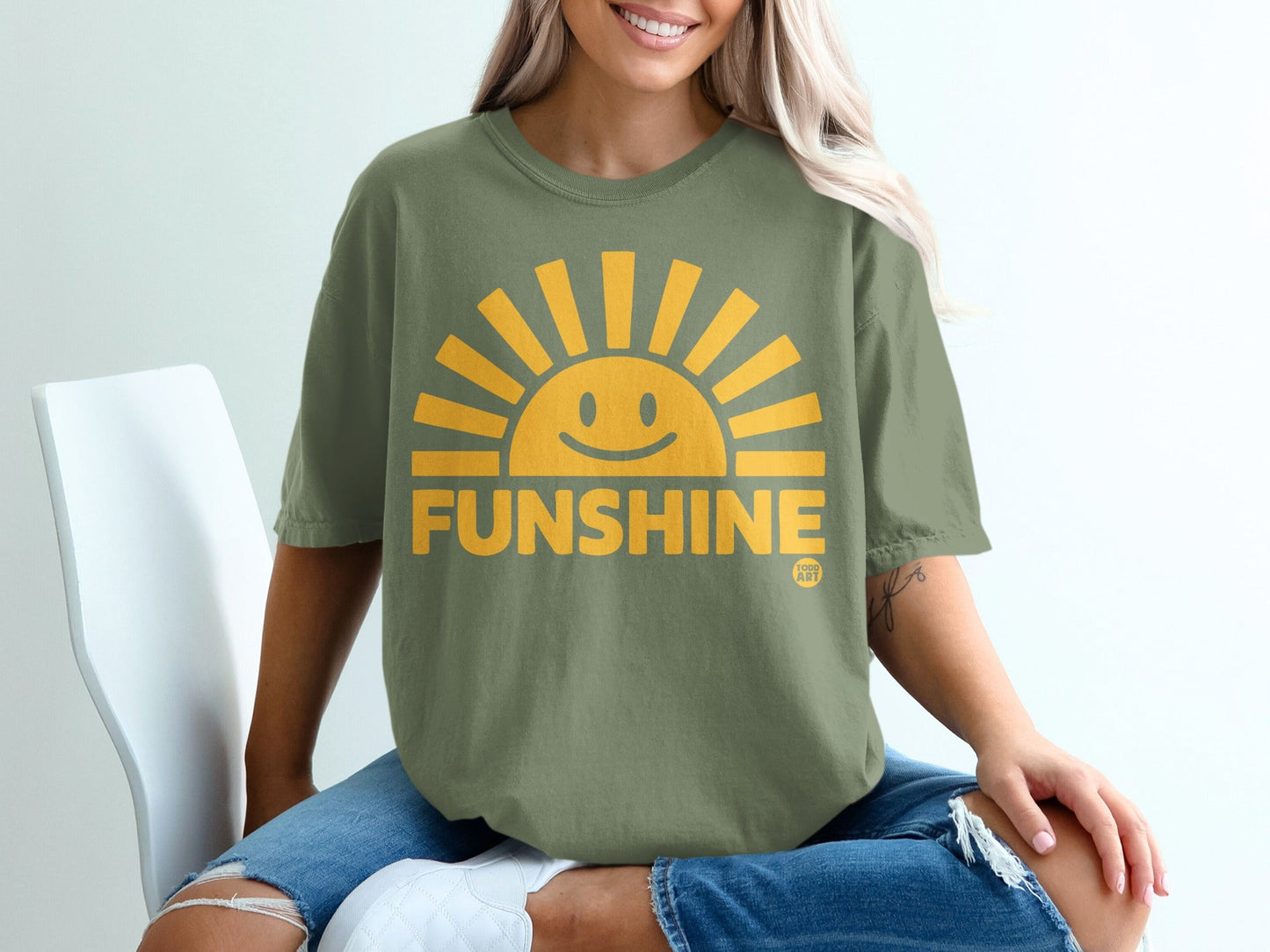 Green t-shirt with a smiling sun graphic and the word "FUNSHINE".
