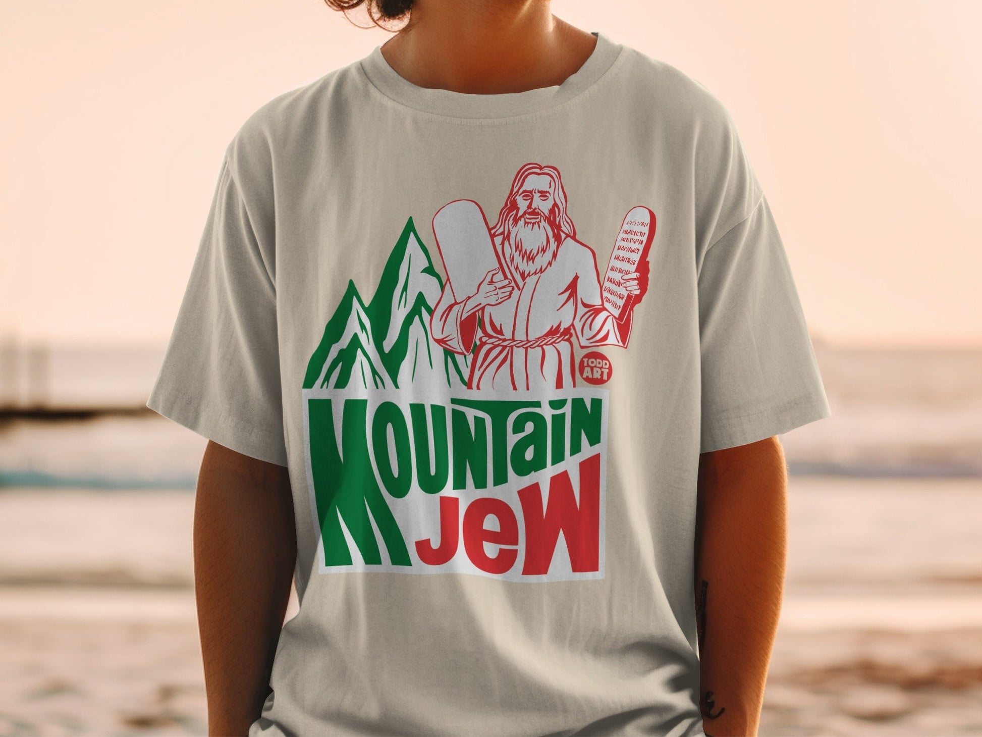 T-shirt with "Mountain Jew" logo, featuring Moses holding tablets.