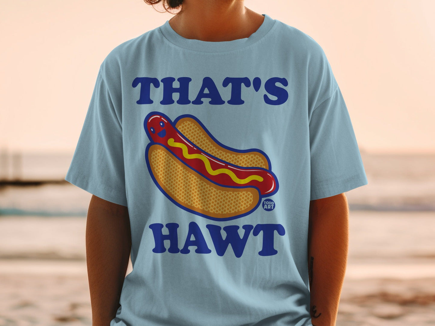 Light blue t-shirt with "THAT'S HAWT" and a cartoon hot dog graphic.