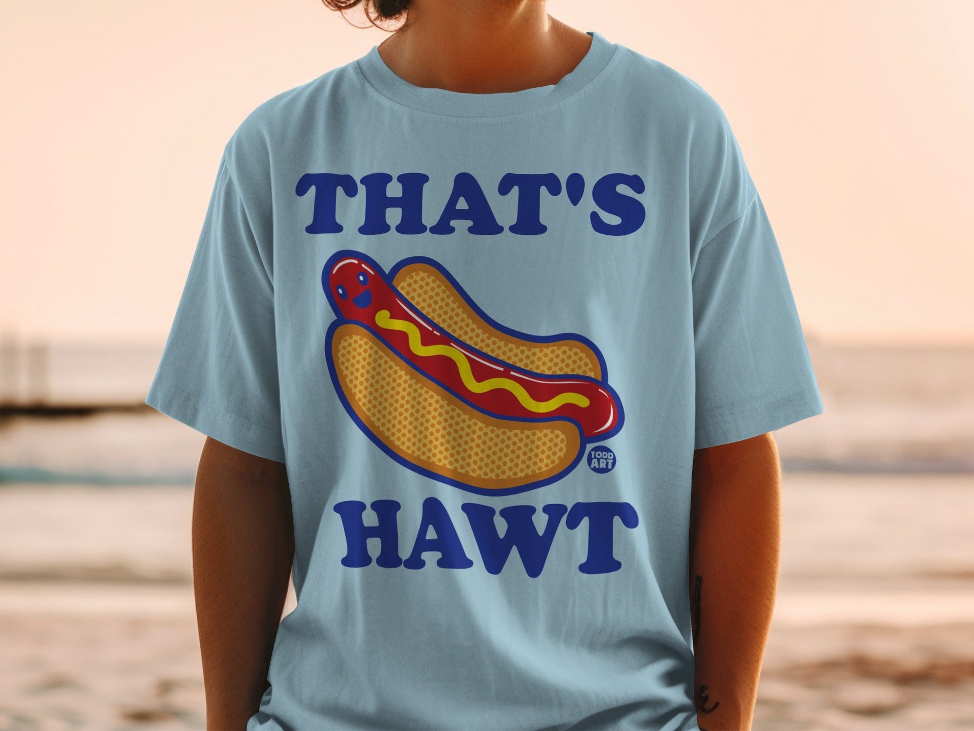 Light blue t-shirt with "THAT'S HAWT" and a cartoon hot dog graphic.