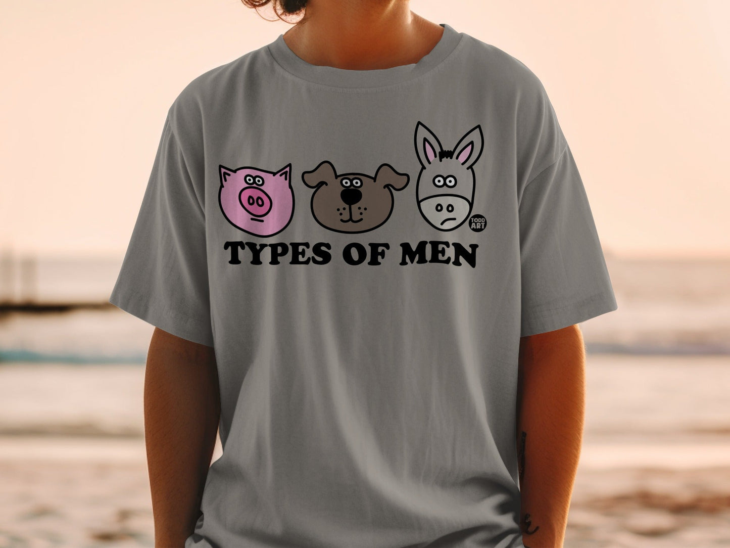 Grey t-shirt with cartoon drawings of a pig, dog, and donkey.