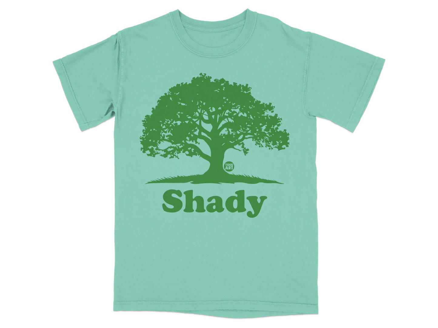 Green t-shirt with a large tree silhouette and the word "Shady" below.