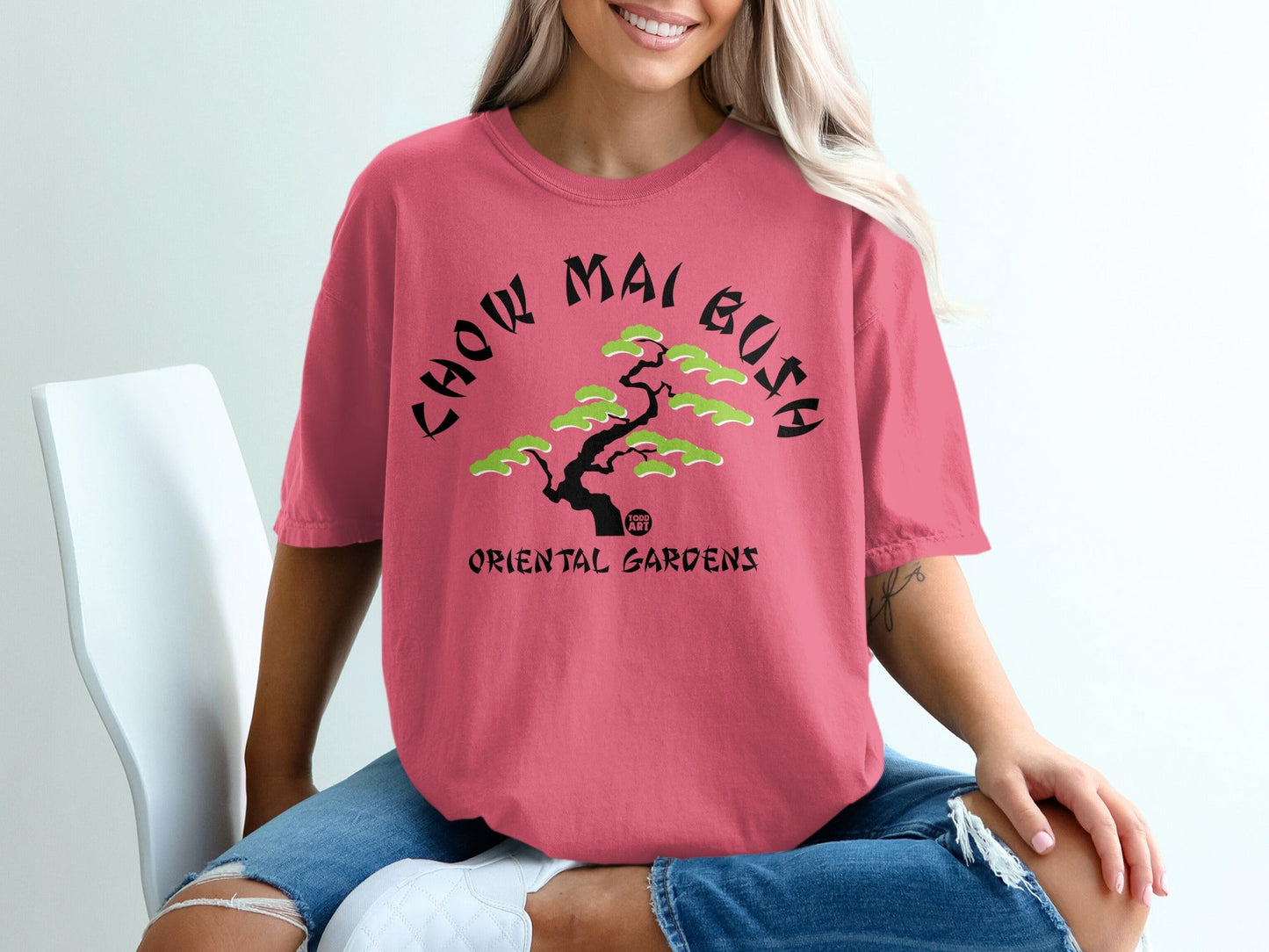 Pink t-shirt with "Chow Mai Bush Oriental Gardens" text and bonsai tree graphic.