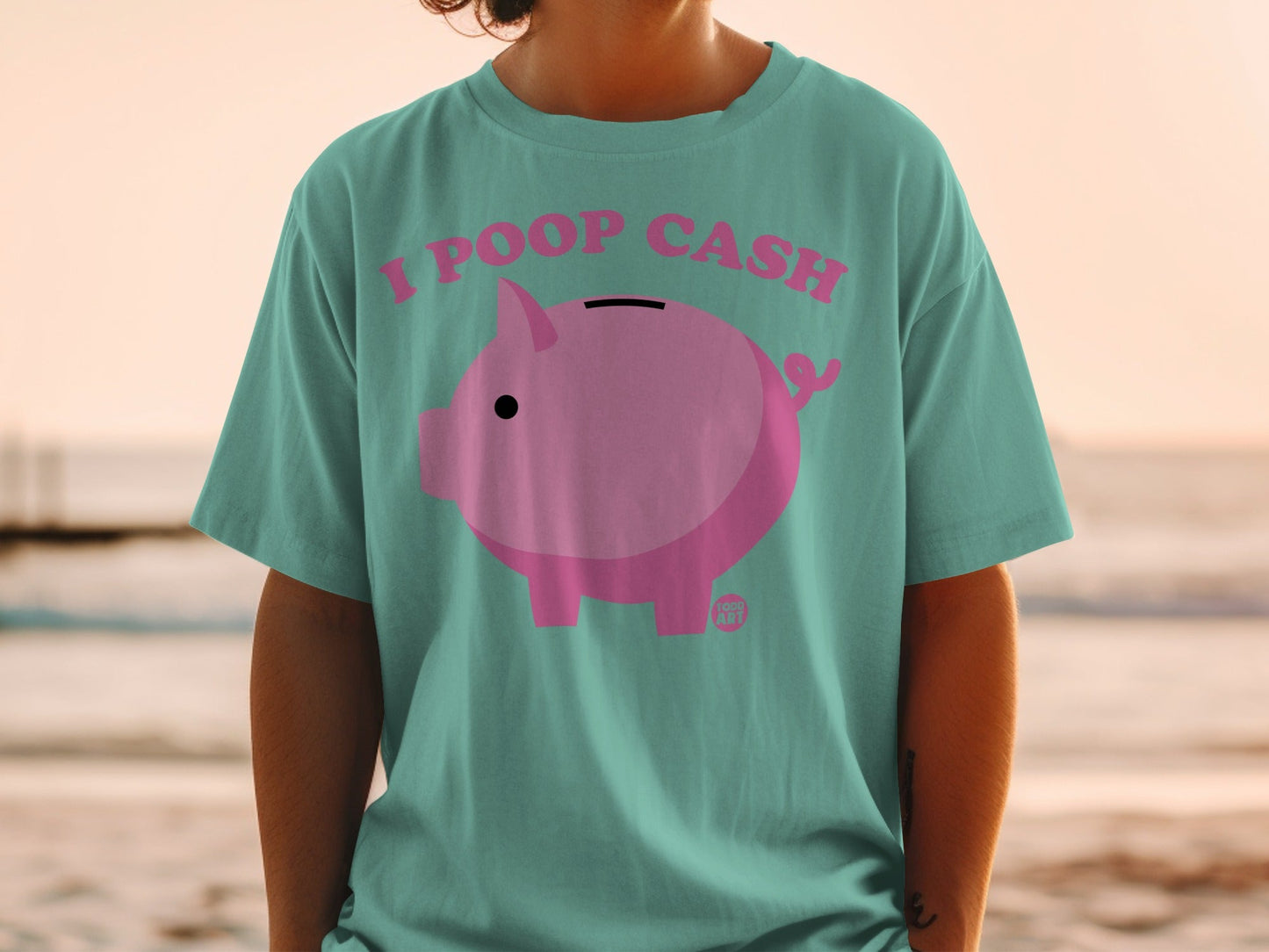 Teal t-shirt with a pink piggy bank graphic and "I POOP CASH" text.