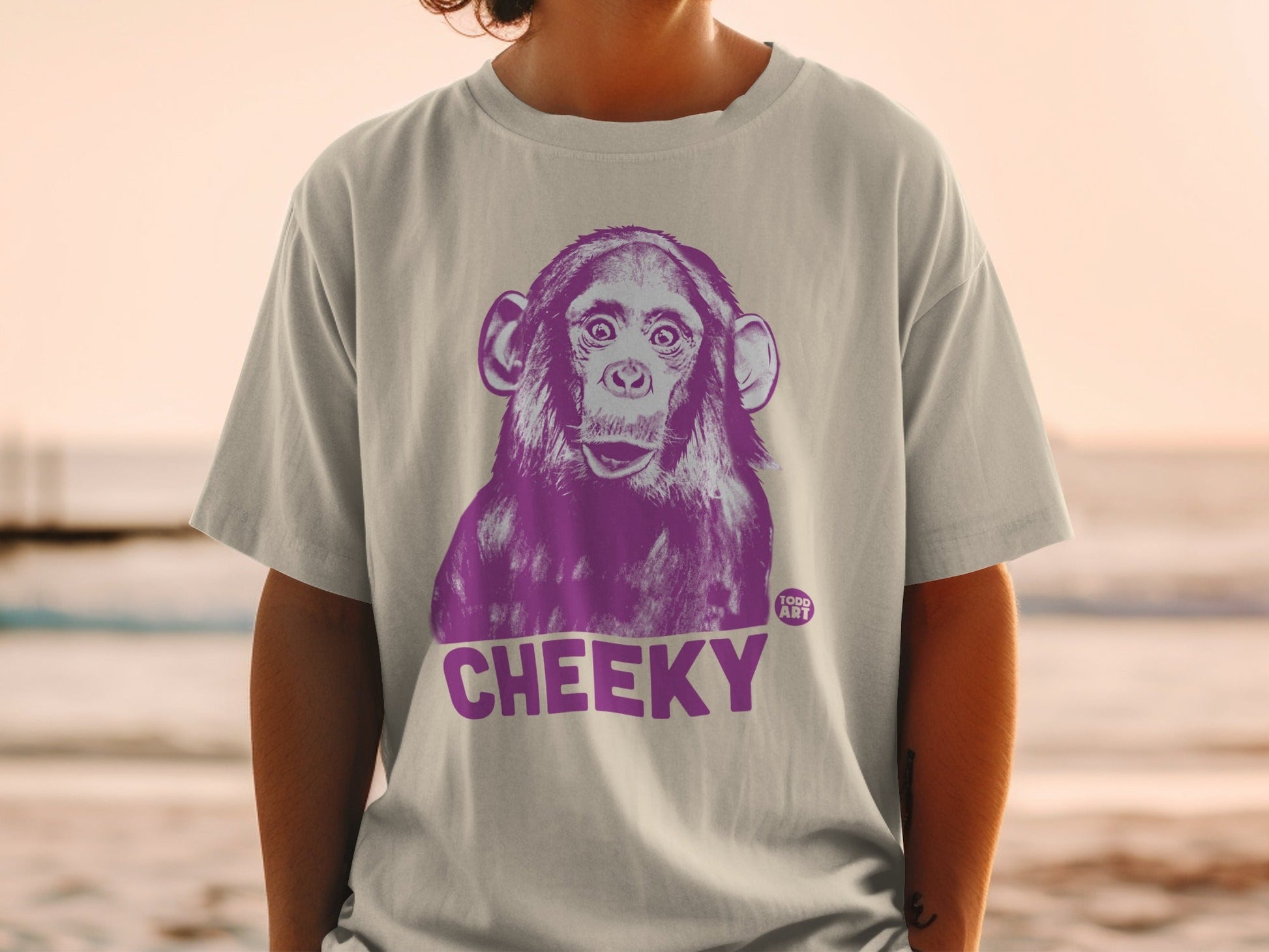 T-shirt with a purple chimpanzee graphic and the word "CHEEKY".