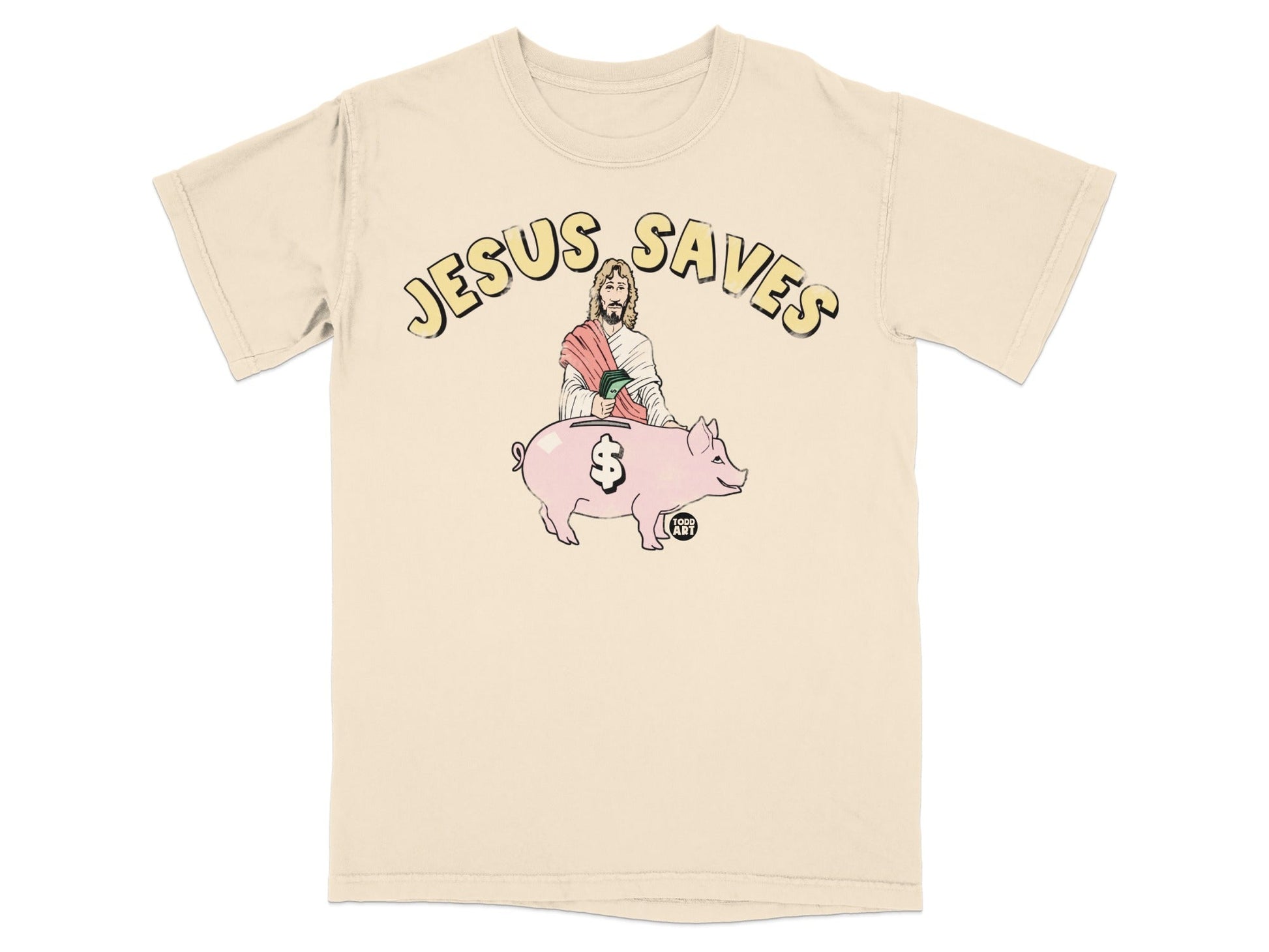 Beige t-shirt with graphic of Jesus placing coin into a piggy bank.