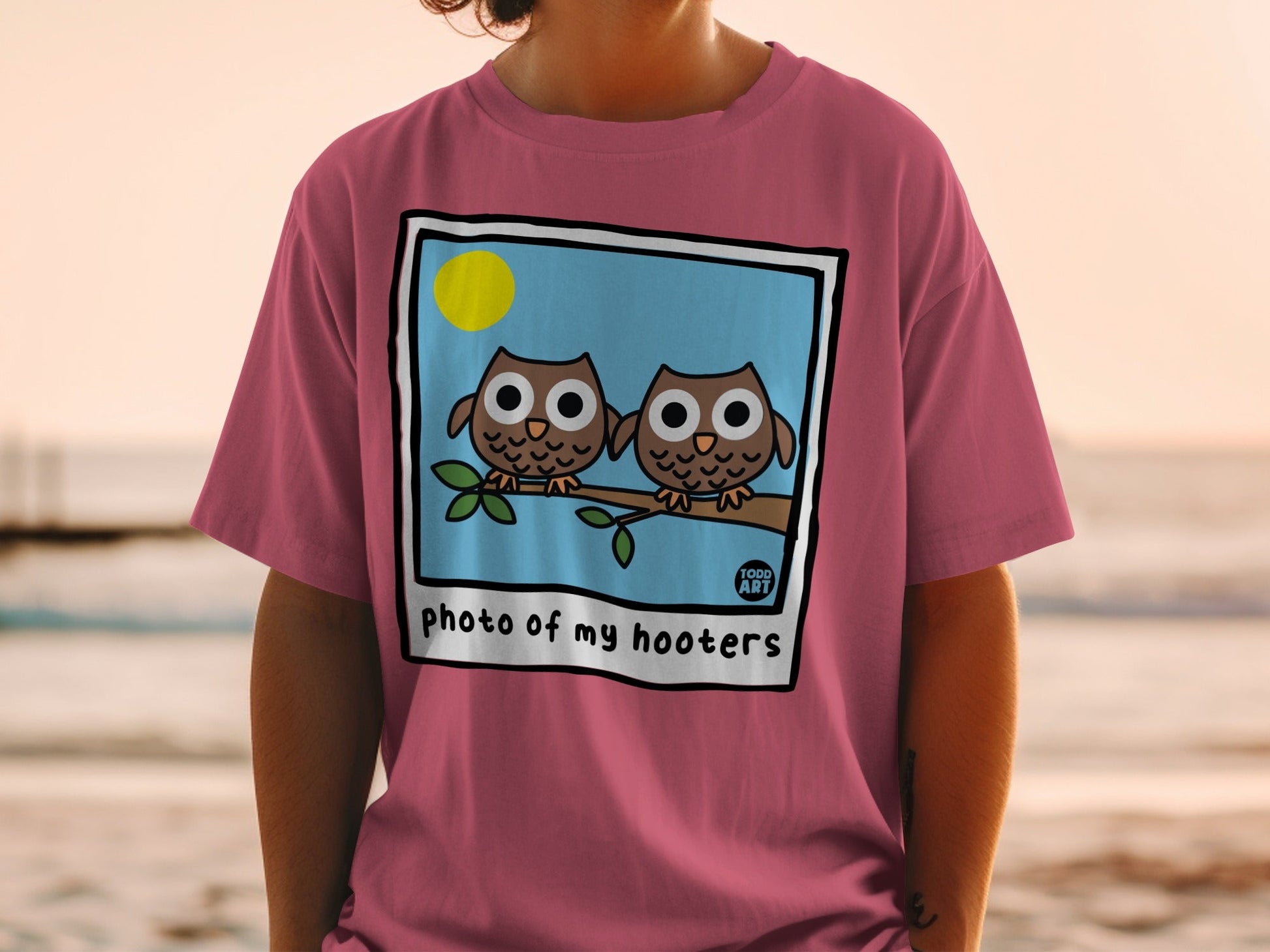 Two cartoon owls on a branch, text "photo of my hooters"