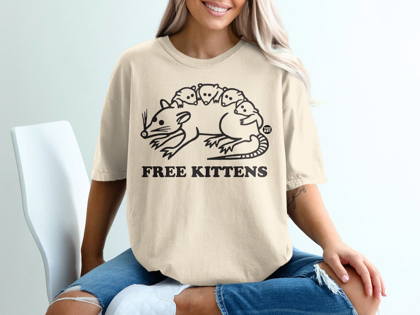 Cream t-shirt with "Free Kittens" text and a rat with kittens on its back.