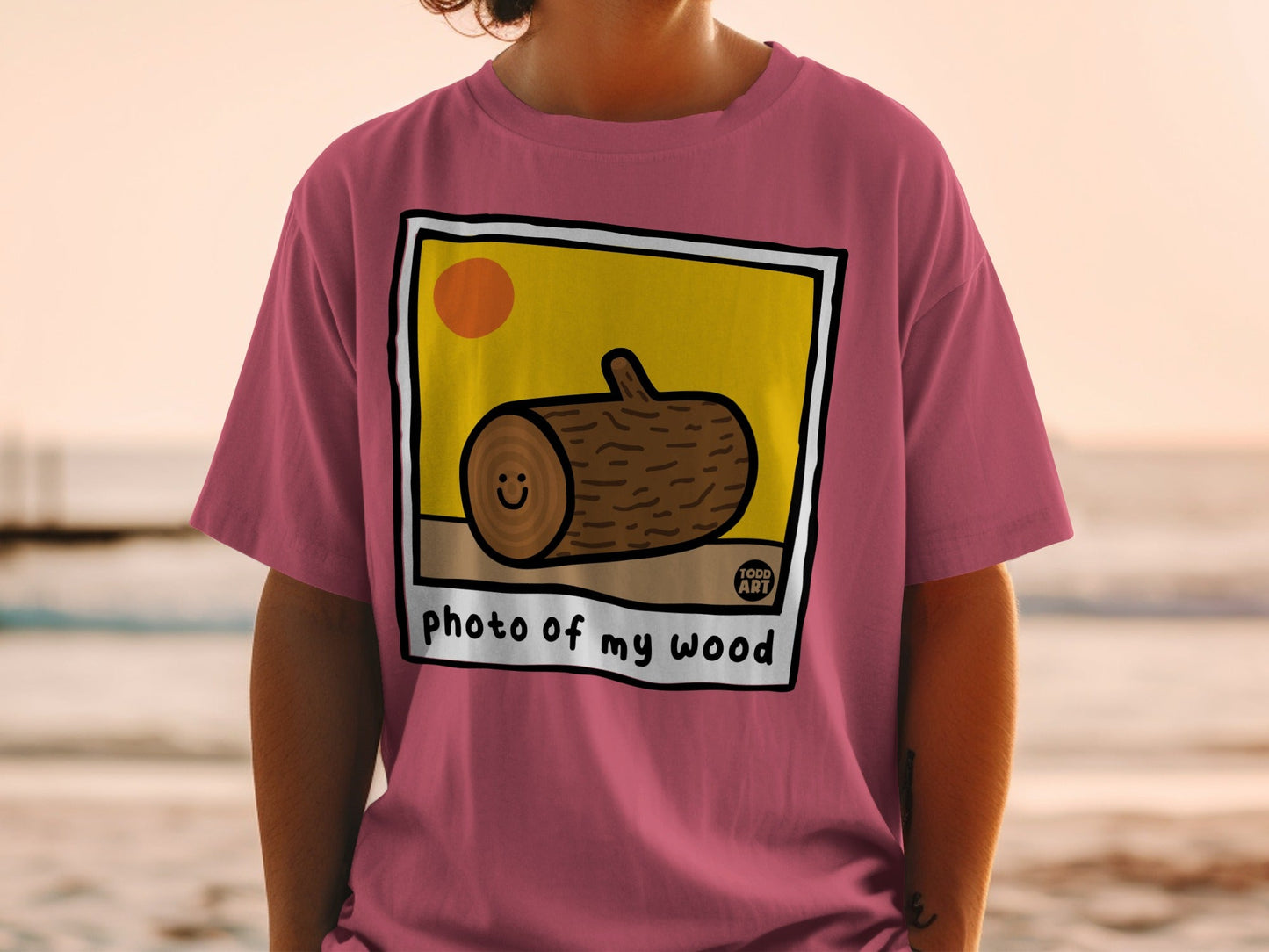 T-shirt with "photo of my wood" and smiling log illustration.