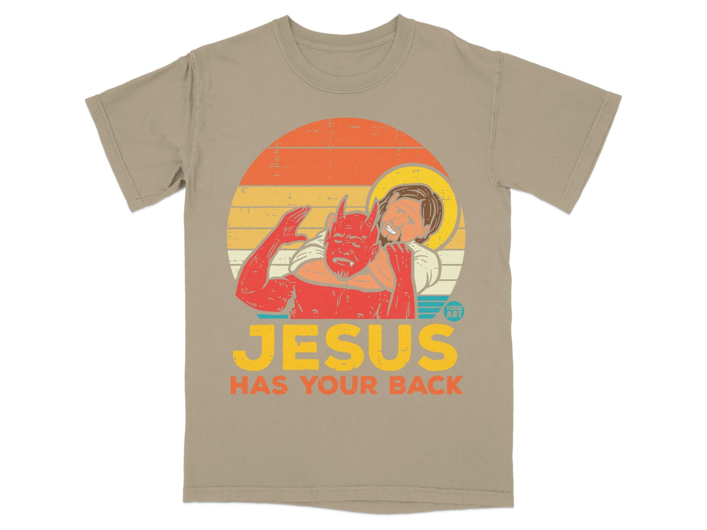 T-shirt with graphic of Jesus embracing a devil figure, text reads "Jesus Has Your Back".