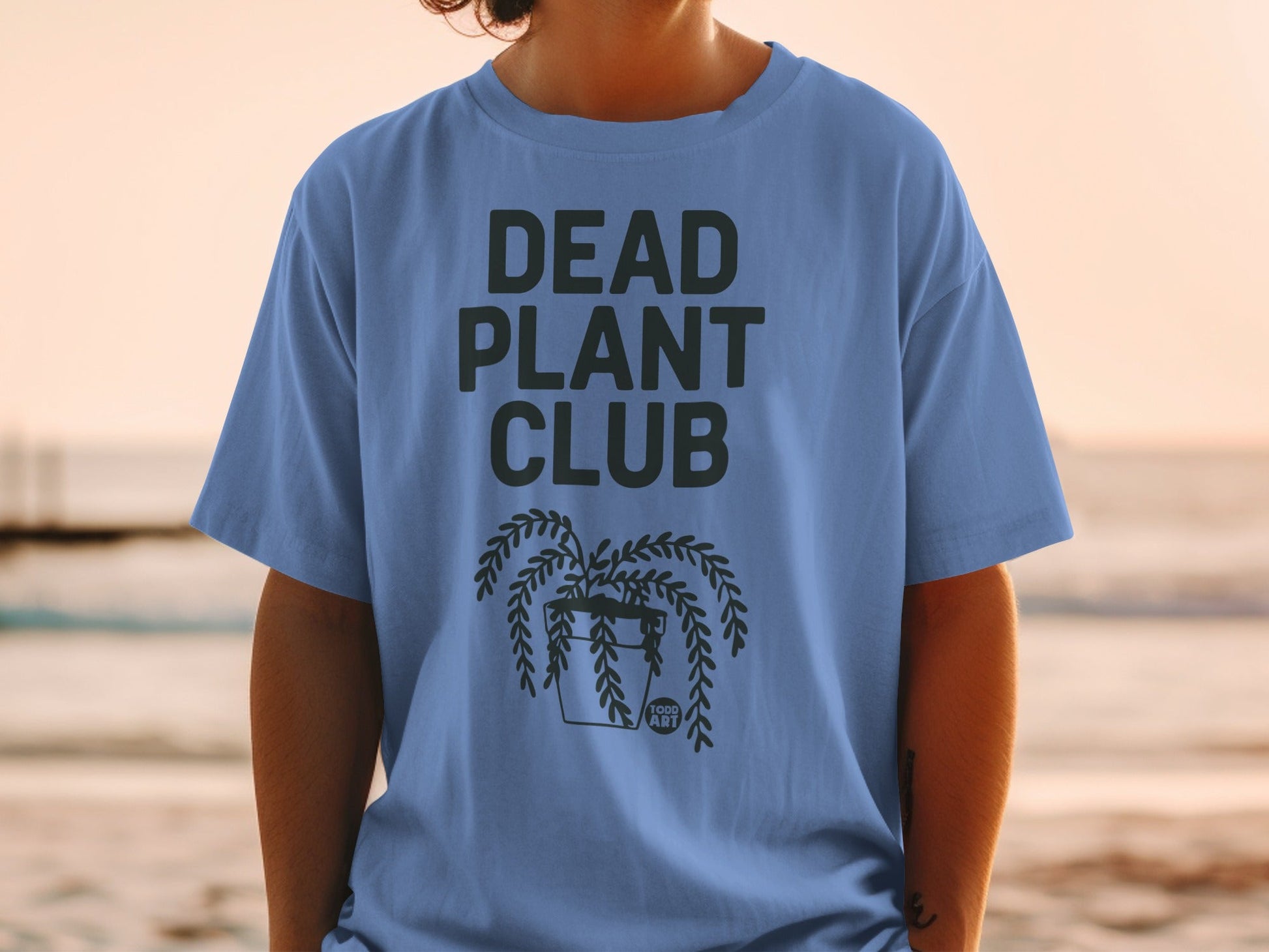 Blue t-shirt with "DEAD PLANT CLUB" and a hanging plant graphic.