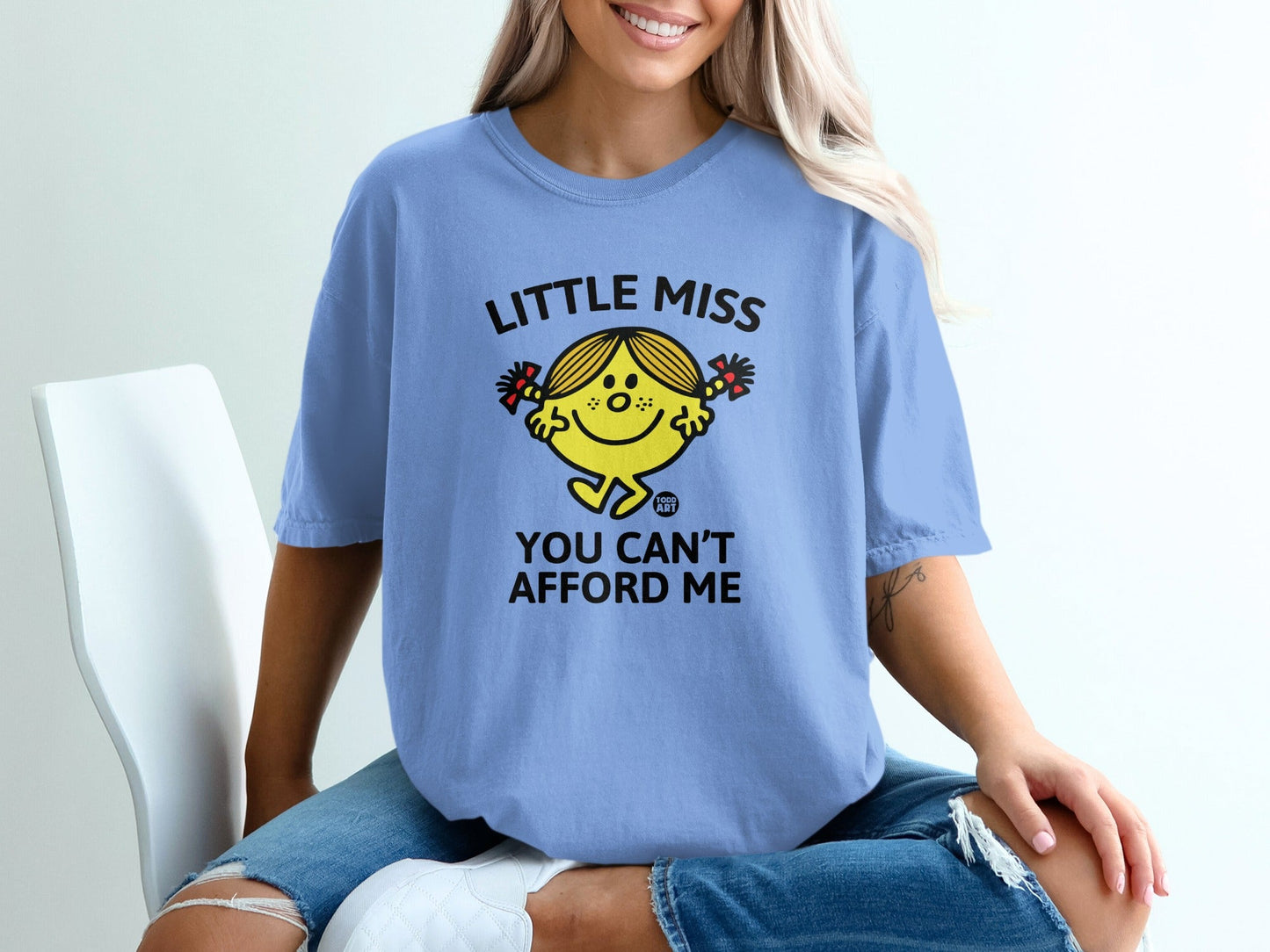 Blue t-shirt with "Little Miss You Can't Afford Me" text and graphic.