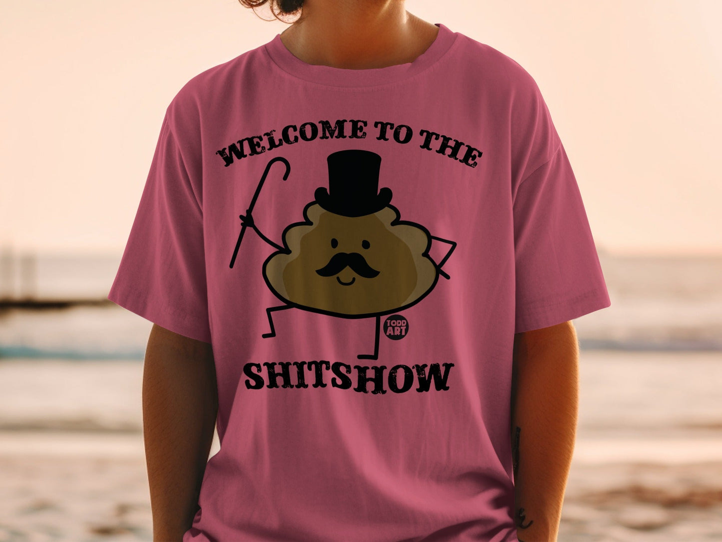 T-shirt with cartoon poop wearing top hat and cane, text "WELCOME TO THE SHITSHOW".
