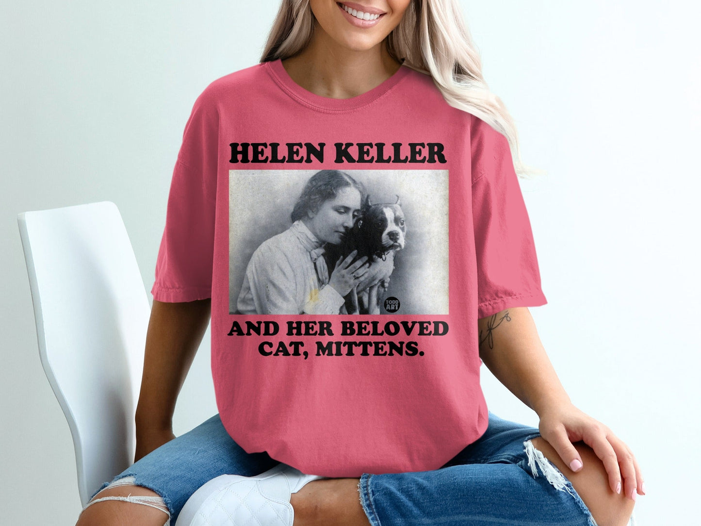 T-shirt with portrait of Helen Keller holding a cat named Mittens.