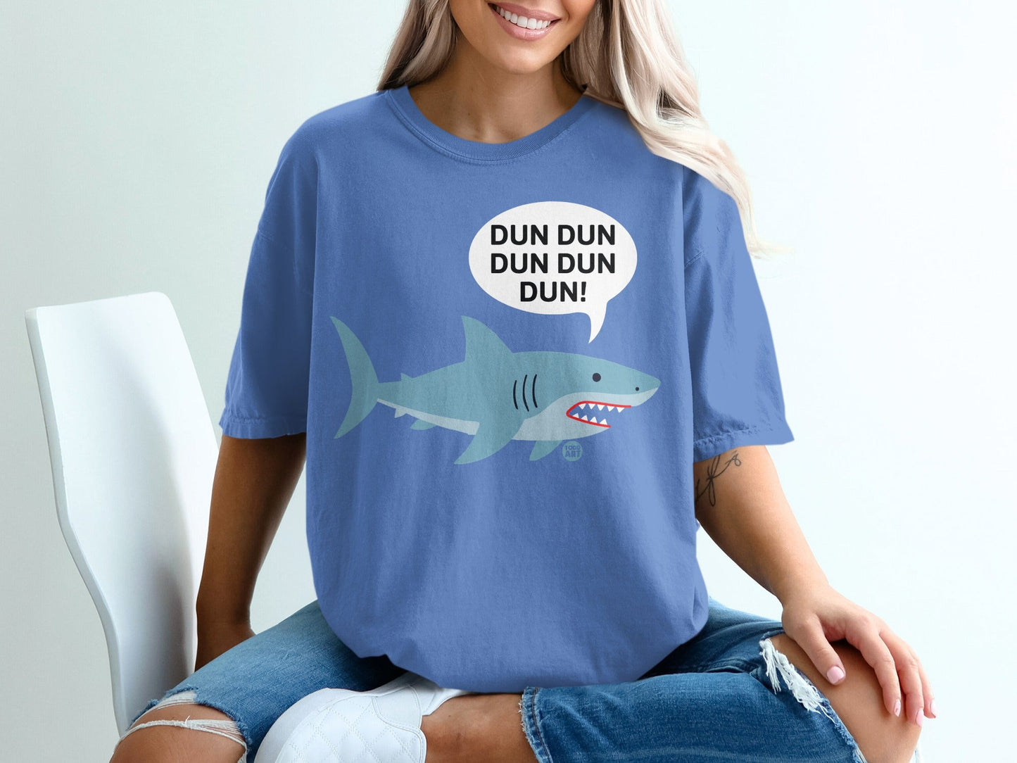 Blue t-shirt with cartoon shark and "DUN DUN DUN DUN!" text.