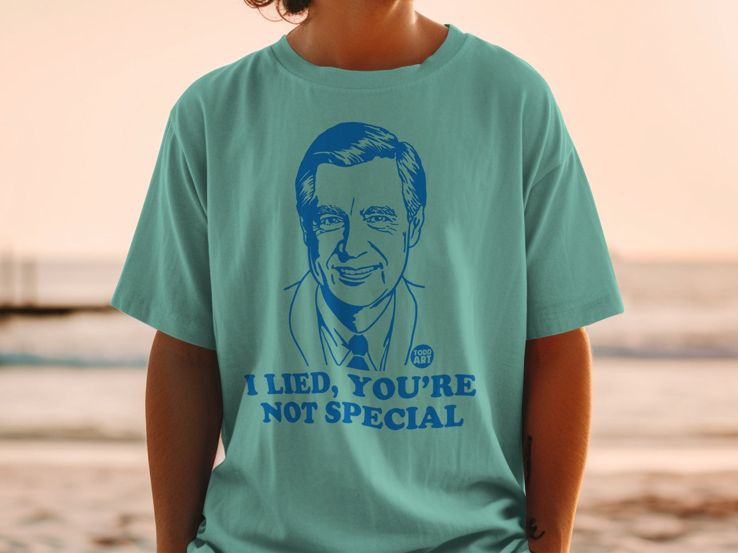 T-shirt featuring Mr. Rogers' portrait with text "I LIED, YOU'RE NOT SPECIAL".