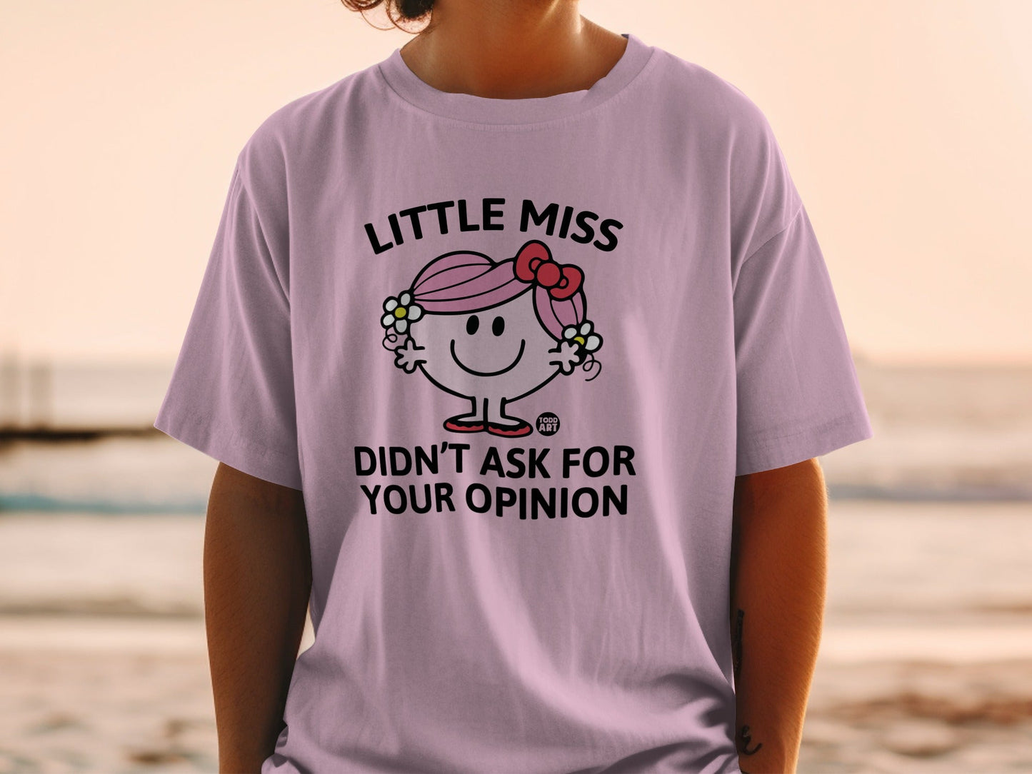 Lilac t-shirt with "Little Miss Didn't Ask For Your Opinion" graphic.
