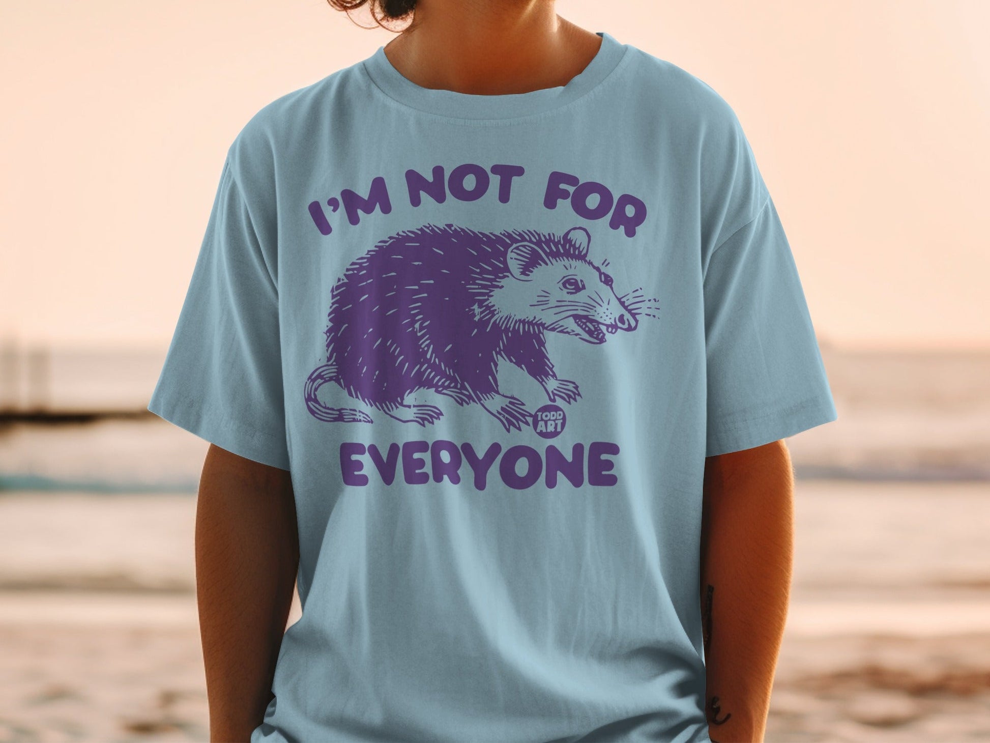 T-shirt with purple opossum graphic and text "I'M NOT FOR EVERYONE".