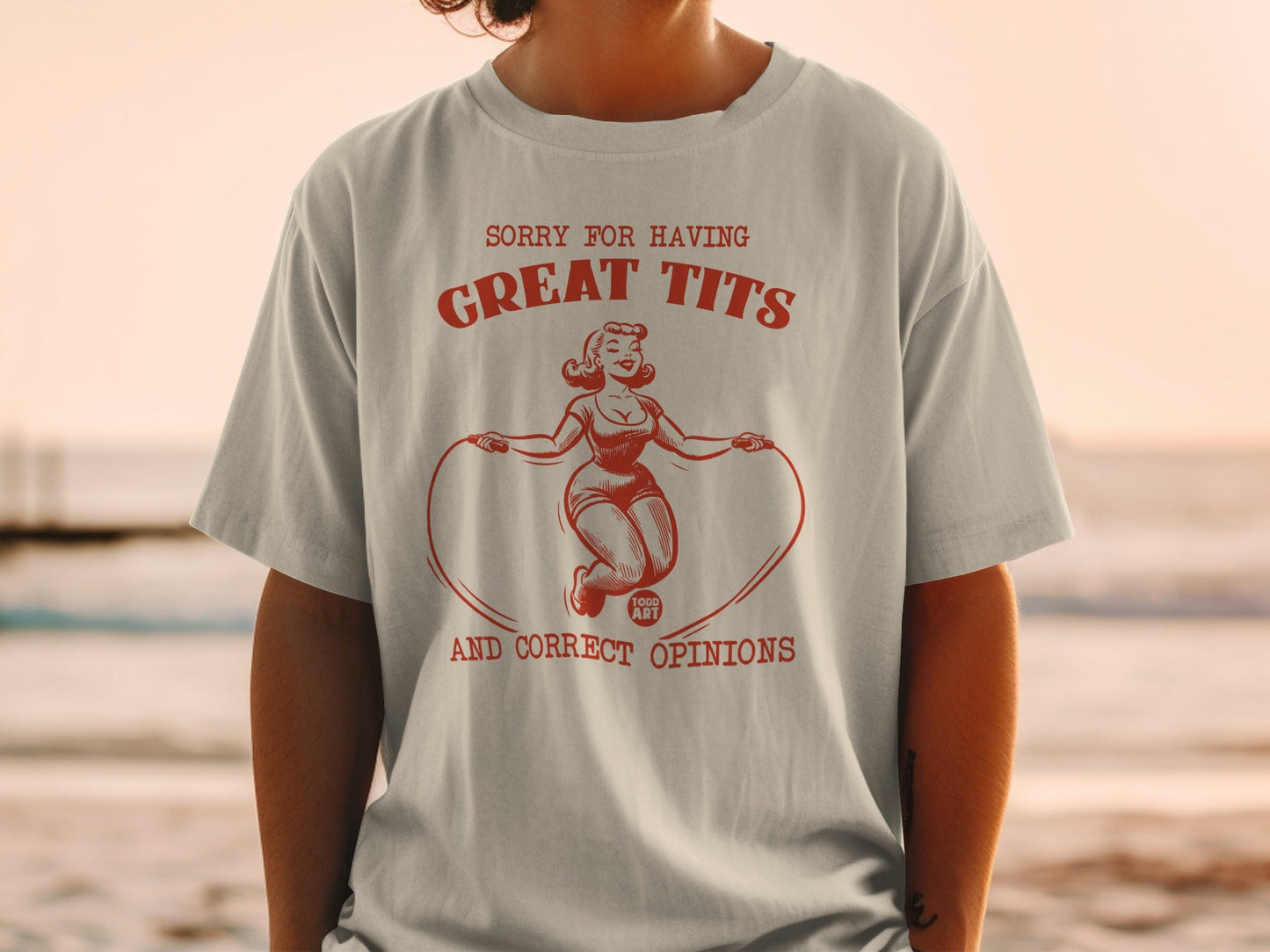 Graphic tee with woman jumping rope, text "SORRY FOR HAVING GREAT TITS AND CORRECT OPINIONS".